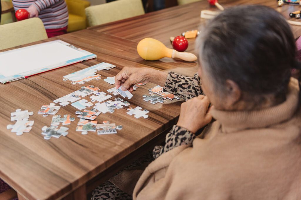 Dementia patient doing a jigsaw